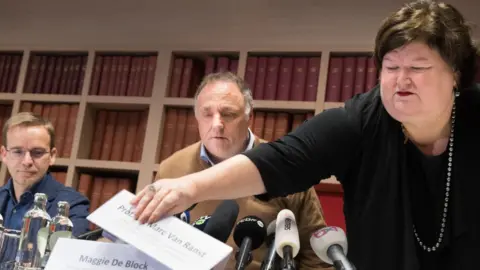 Getty Images Lieutenant Colonel Patrick Soentjes, Marc Van Ranst and minister Maggie De Block in February 2020