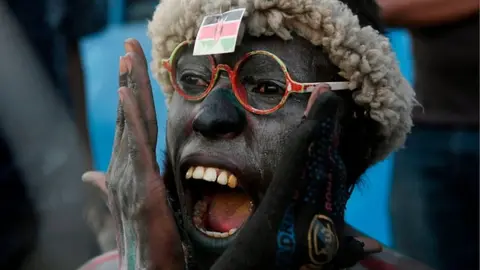 Getty Images A Kenyan football supporter celebrates (archive shot)
