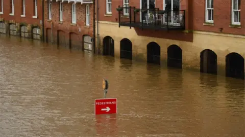 AFP Scenes of flooding in North Yorkshire as the level of the River Ouse rose in York