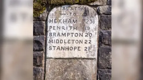 Getty Images Alston traditional stone road sign