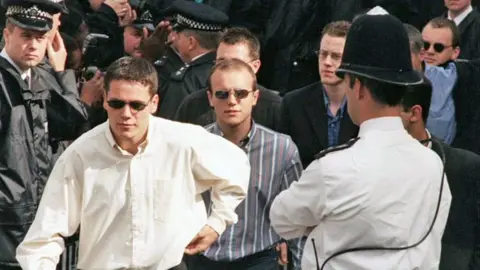 PA Media Jamie and Neil Acourt (front), David Norris and Gary Dobson in 1998