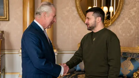 PA Media King Charles shaking hands with Ukrainian President Volodymyr Zelensky