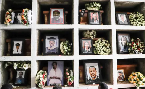 AFP Portraits of victims of the crashed accident of Ethiopian Airlines are displayed during the mass funeral at Holy Trinity Cathedral in Addis Ababa, Ethiopia, on March 17, 2019