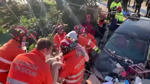 Firefighters rescuing people from the Turkey-Syria earthquake