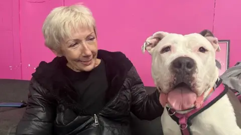 Nicola Haseler/BBC Loretta Carson and her dog Annie