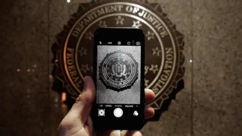 Getty Images Official seal of the FBI is seen on an iPhone's camera screen on February 23, 2016 in Washington DC