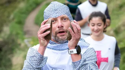 Dorsetbays Andy Mutter marathon with coconuts