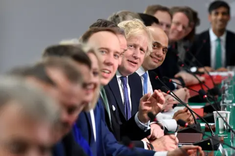 PAUL ELLIS / AFP Britain's Prime Minister Boris Johnson (C) chairs a cabinet meeting at the National Glass Centre at the University of Sunderland, in Sunderland, northeast England on 31 January 2020.