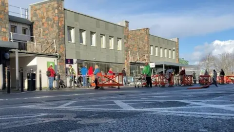 BBC Queuing outside supermarket