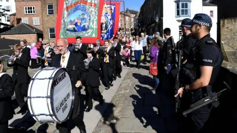 AFP/GETTY IMAGES Armed police at parade
