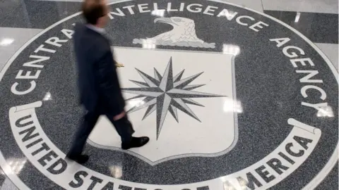 AFP/Getty A man crosses the Central Intelligence Agency (CIA) seal in the lobby of CIA Headquarters