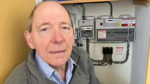 David Murdoch in his meter cupboard