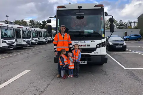 Make-A-Wish UK    Josiah and siblings in front of bin lorry