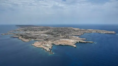 Getty Images Aerial view of the island of Lampedusa on August 04, 2020 in Lampedusa, Italy