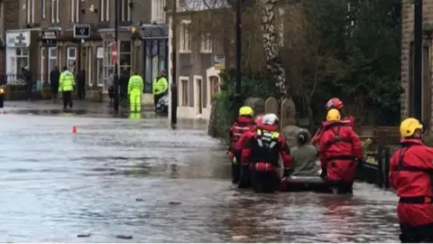 Resident rescued on an inflatable boat