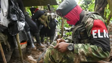 Getty Images Members of the Ernesto Che Guevara front, belonging to the National Liberation Army (ELN) guerrillas