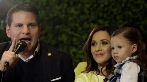 Reuters Fabricio Alvarado, presidential candidate of the National Restoration party (PRN), speaks to his supporters next to his wife Laura Moscoa and his daughter during a rally after Costa Rica's presidential election in San Jose, Costa Rica February 4, 2018.