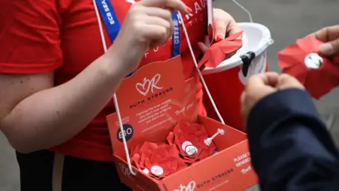 Getty Images Charity volunteer makes collection