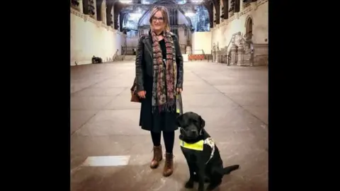 Kirsty James Kirsty James with her guide dog