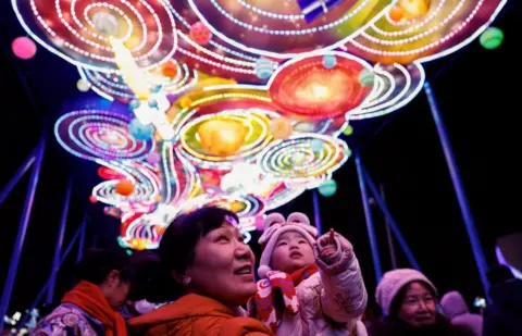 Reuters People enjoy light installations at a park on Lantern Festival in Beijing, China