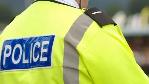 Getty Images Police officer in high vis jacket