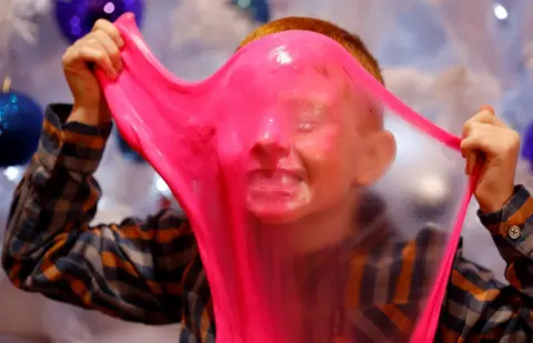 Peter Nicholls/ Reuters Tristan Robertson-Eyes, aged 7, plays with Elasti Plasti.