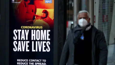 PA Media Covid poster at a bus stop on Glasgow