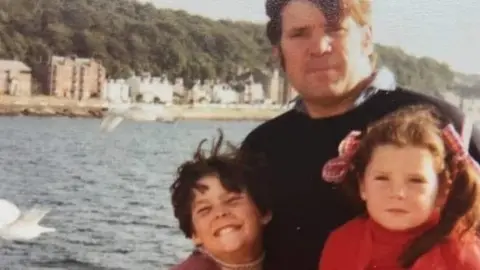 Brian Higgins with his daughters, Monica and Noelle