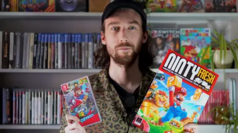 Jon Doyle Jon with Mario's latest adventure, Super Mario Odyssey and a Nintendo magazine