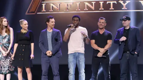 Getty Images Chadwick Boseman (centre) speaking at an event to celebrate the forthcoming movie. He reprises his Black Panther role as T-Challa.