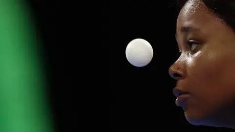 Reuters A close up of Zodwa Maphangain staring intently at a ping pong ball.