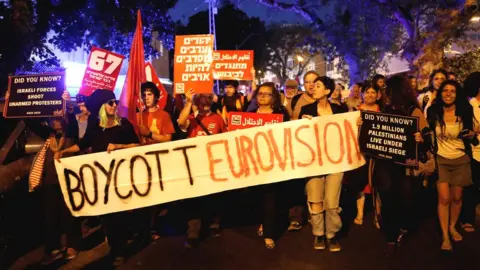 Reuters Protesters hold banners and placards as they take part in a demonstration calling for an end to Israel's policy towards Gaza and a boycott of the 2019 Eurovision Song Contest in Tel Aviv, Israel