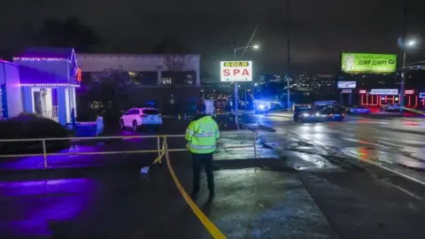 EPA Atlanta Police Department officers investigate the scene of a shooting outside a spa on Piedmont Road in Atlanta, Georgia, USA, 16 March 2021