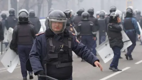 Getty Images Riot police in Almaty