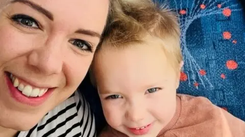 Emma Gooding Emma and her child