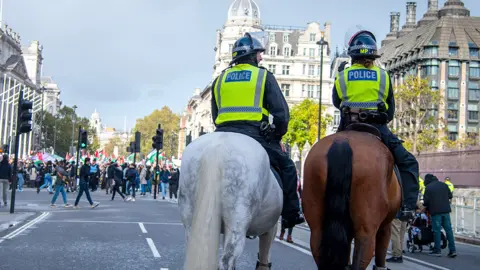 Shutterstock Met officers on horseback as they watch over demonstration in London