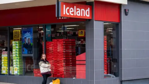 Getty Images Woman outside Iceland store