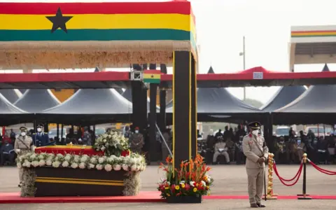 Getty Images The casket of former Ghana President Jerry John Rawlings is seen during his final funeral rites in Accra, Ghana, on January 27, 2021. - Former Ghana President Jerry John Rawlings died in November 2020 at the age of 73 and his funeral was initially scheduled for December 23, 2020 but was postponed, due to what the foreign ministry called "unforeseen circumstances".