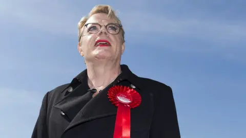 Getty Images Eddie Izzard with a Labour rosette