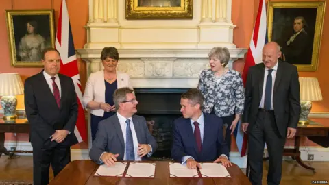 PA Media DUP and Conservatives signing confidence and supply agreement