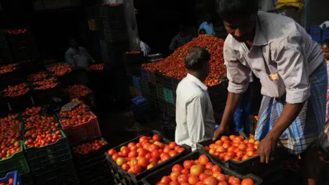 Getty Images Tomatoes at a market