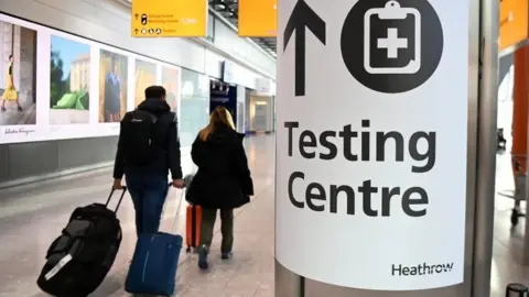 EPA Passengers arrive at Heathrow Airport in London