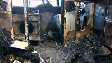 BBC Fire damage in the flat of Bernard Hender and Doug McTavish in Conwy