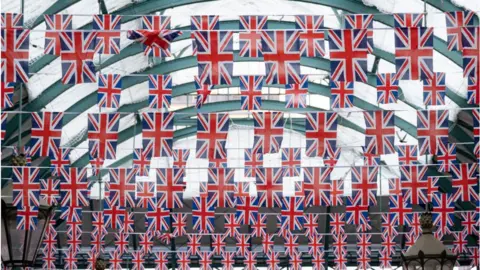 Getty Images Union flags hanging in Covent Garden Market, London