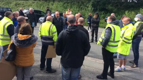 BBC Daryl Williams from union Unite speaks to workers at Northwood tissue factory in Penygroes, Gwynedd