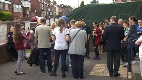 People coming together for the vigil