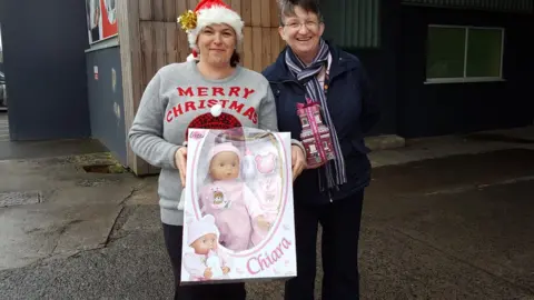Marie Griffiths (left) and Nia Thomas with one of the toys