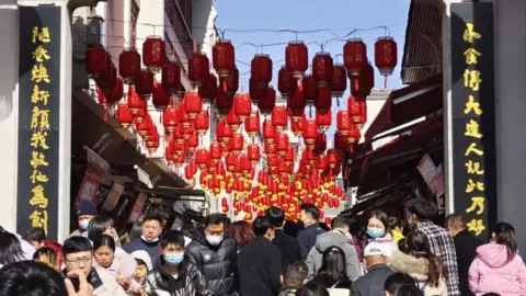 Getty Images Hubu Alley decorated with red lanterns during the Spring Festival holiday on January 24, 2023 in Wuhan