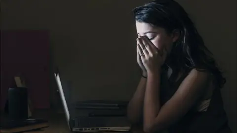 Getty Images Upset girl on her laptop