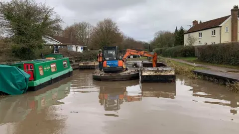 Canal and River Trust dredging the canal from Firepool Lock to the M5 crossing in Taunton